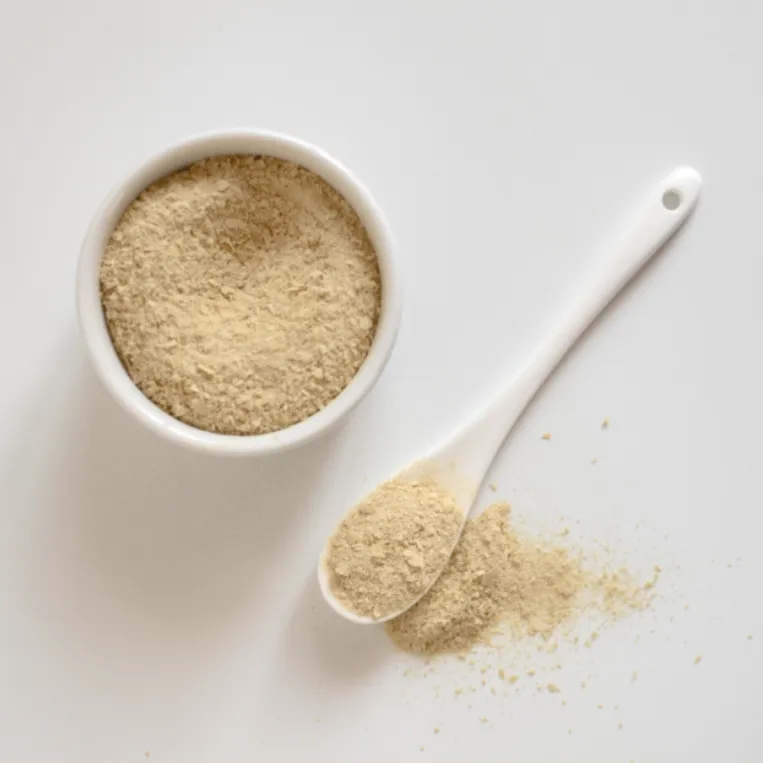 A bowl and spoon of yeast protein powder